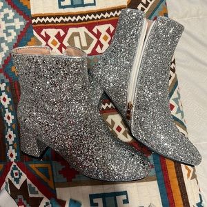 Sparkly ankle booties. They are a size 8 true to size. They are silver sparkly.